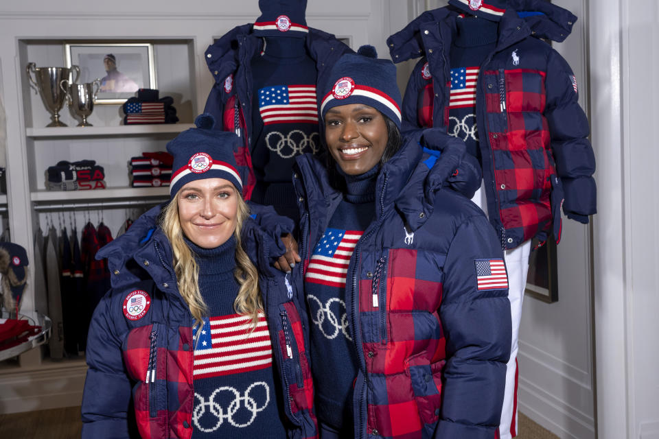 Snowboarder Jamie Anderson, left, and bobsledder Aja Evans model the Team USA Beijing winter Olympics closing ceremony uniforms designed by Ralph Lauren on Wednesday, Oct. 27, 2021, in New York. (Photo by Charles Sykes/Invision/AP)