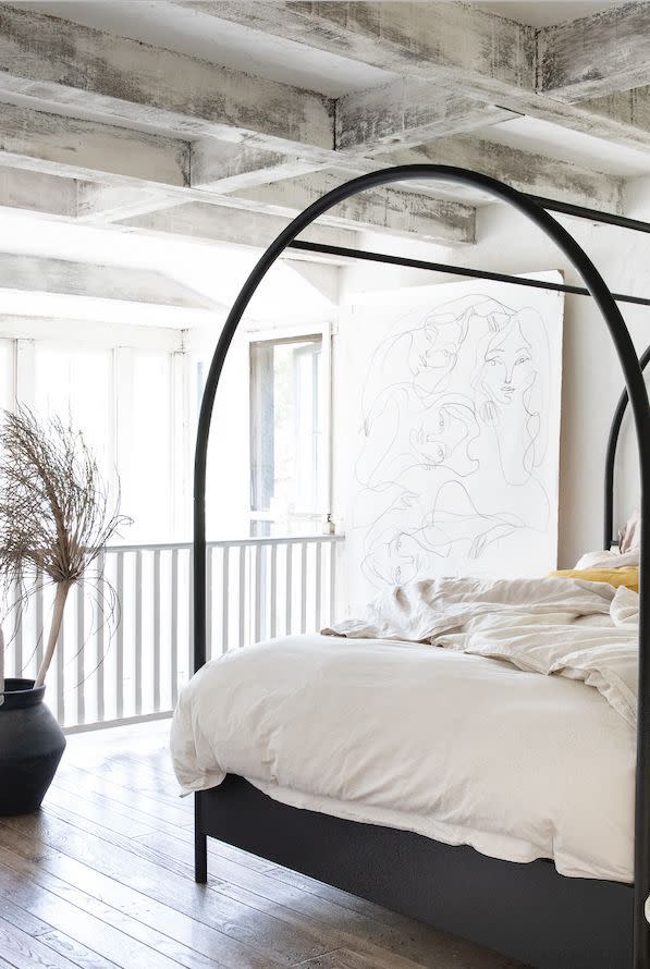 8) Try an Arched Canopy Bed