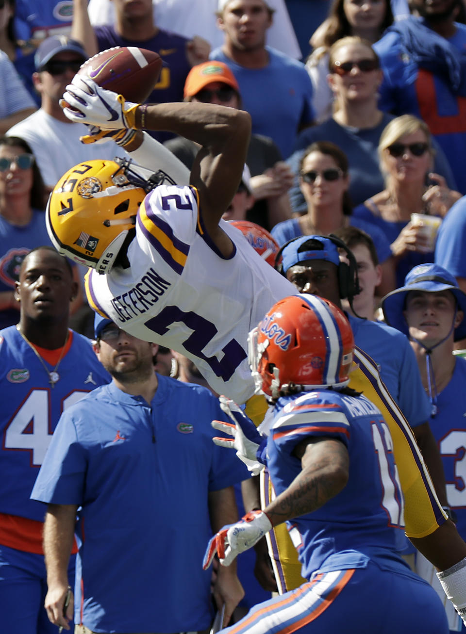 LSU wide receiver Justin Jefferson (2) catches a pass over Florida defensive back C.J. McWilliams, right, during the first half of an NCAA college football game, Saturday, Oct. 6, 2018, in Gainesville, Fla. (AP Photo/John Raoux)