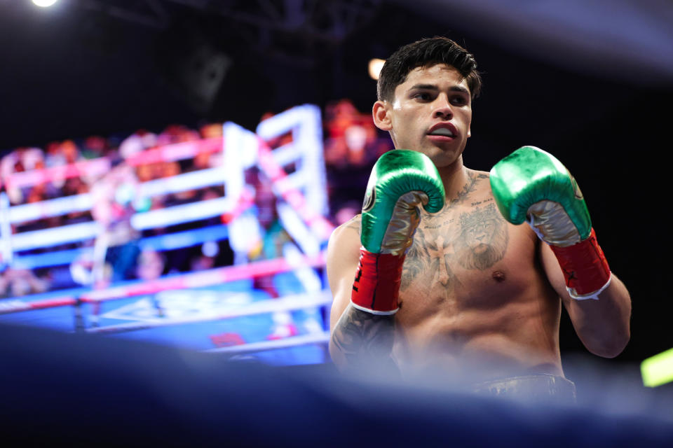 SAN ANTONIO, TEXAS - APRIL 09: Ryan Garcia and  Emmanuel Tagoe exchange punches during their Lightweight bout at the Alamodome on April 09, 2022 in San Antonio, Texas. (Photo by Carmen Mandato/Getty Images)