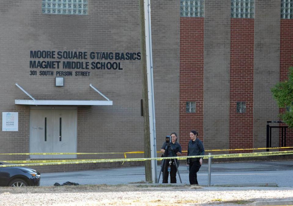 Law enforcement work near the scene of a shooting near Moore Square Magnet Middle School on Monday, Oct. 23, 2023, in Raleigh, N.C.