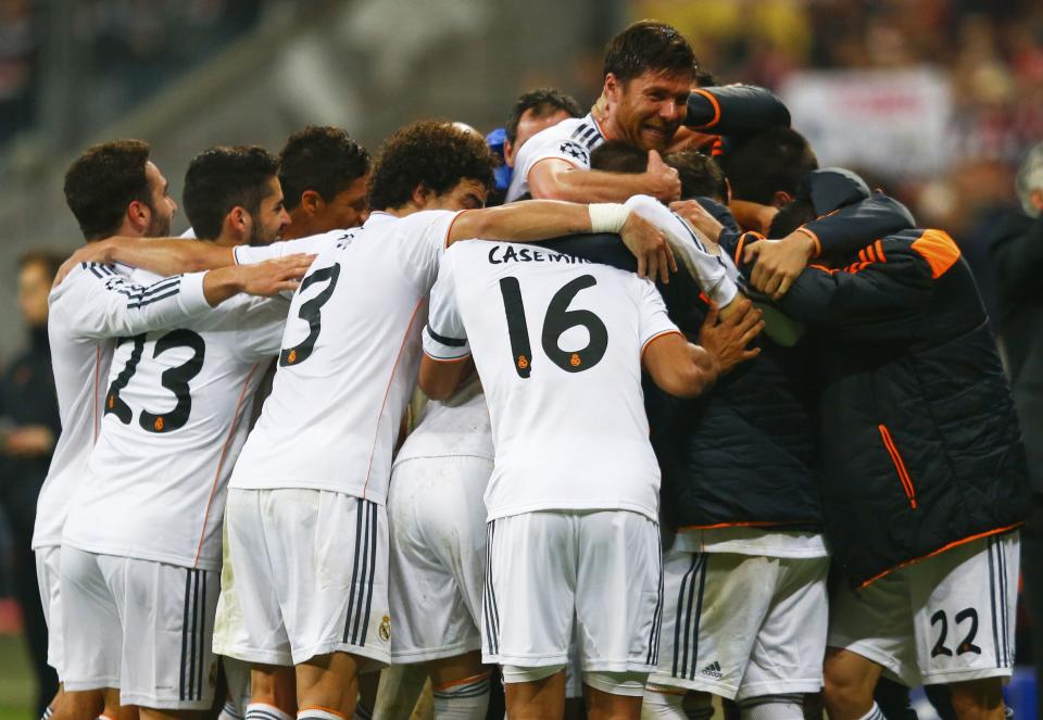 Real Madrid's Alonso celebrates with team mates their fourth goal against Bayern Munich during their Champions League semi-final second leg soccer match in Munich