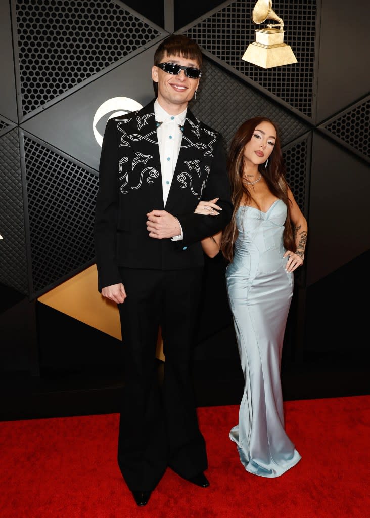 (L-R) Peso Pluma and Nicki Nicole attends the 66th GRAMMY Awards at Crypto.com Arena on February 04, 2024 in Los Angeles, California.