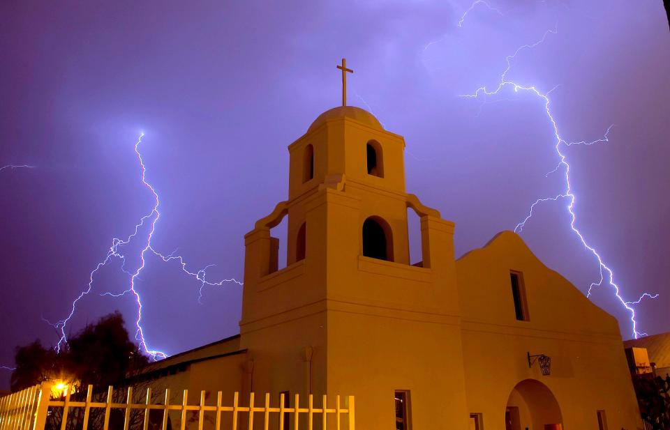 Lightning rips through the night sky over the Old Adobe Mission in downtown Scottsdale in 2009.