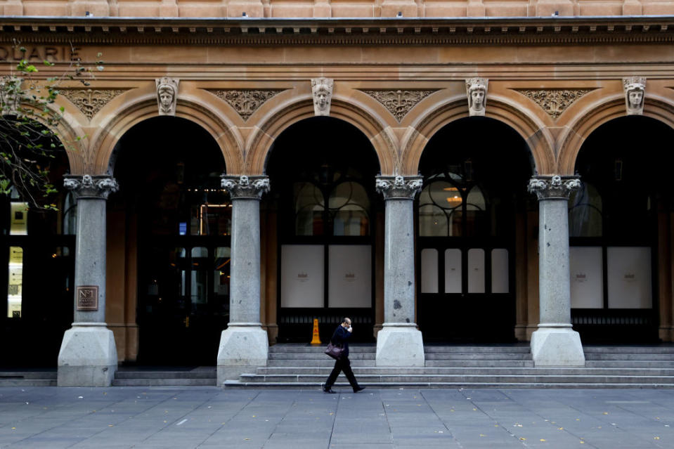 Image of someone walking through empty Sydney CBD