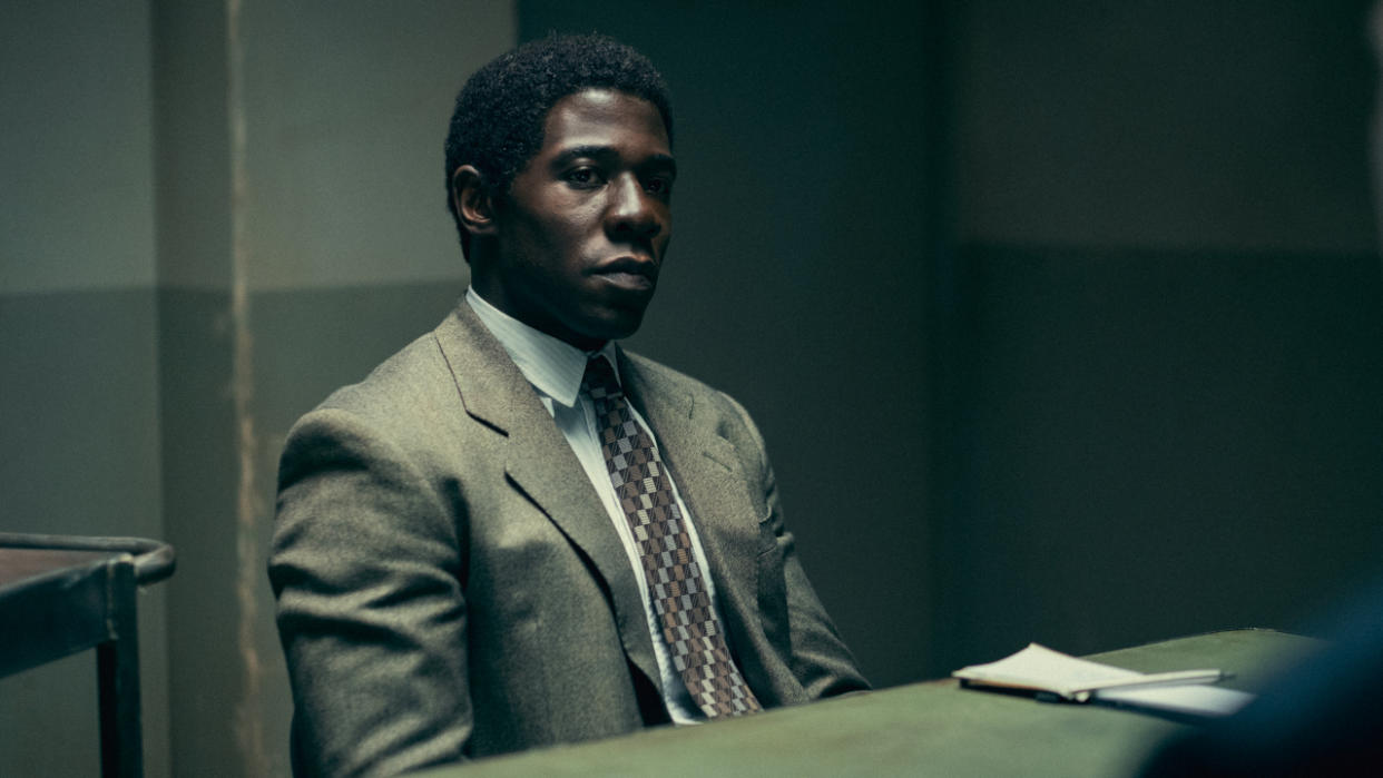  McKinley Belcher III sits stoically at an interrogation room table in Eric. 