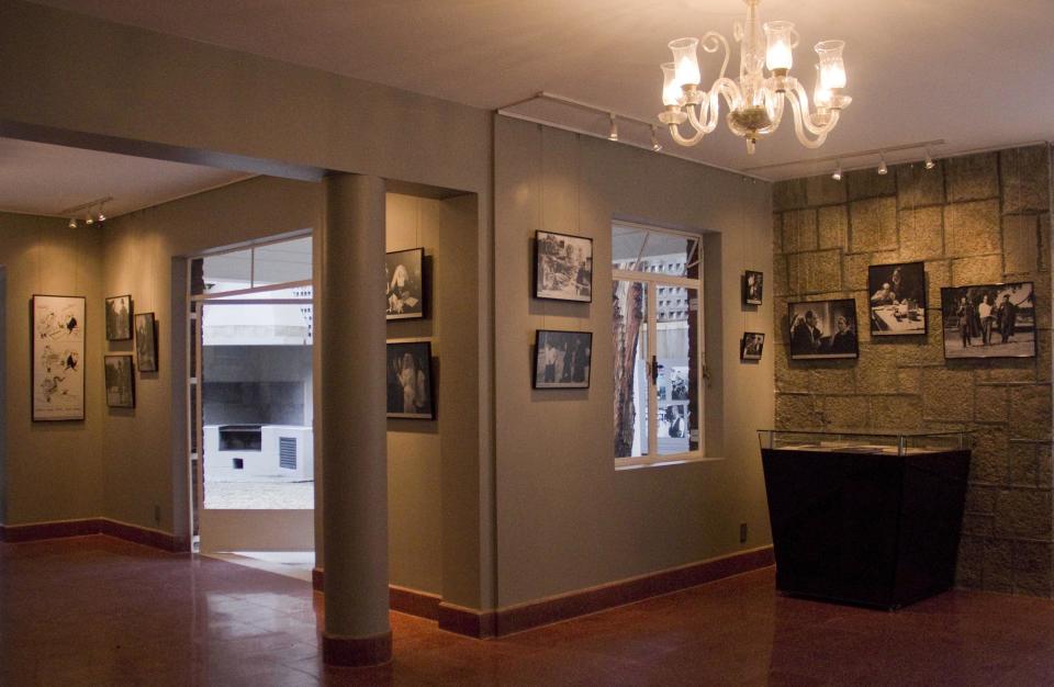 In this Aug. 1, 2013 photo, photographs about the life and films of Luis Bunuel hang at the "Casa Bunuel" in Mexico City. Critics still regard Bunuel as one of cinema’s greatest directors with movies such as "L’Age d’Or" and "That Obscure Object of Desire" pushing the boundaries of both taste and narrative. (AP Photo/Gabriela Sanchez)