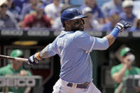 Kansas City Royals' Carlos Santana hits a two-run single during the sixth inning of a baseball game against the Oakland Athletics Sunday, June 26, 2022, in Kansas City, Mo. (AP Photo/Charlie Riedel)