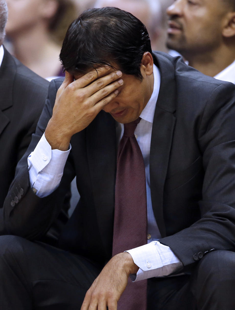 Miami Heat head coach Erik Spoelstra holds his head in the second half of an NBA basketball game against the Washington Wizards, Monday, April 14, 2014, in Washington. The Wizards won 114-93. (AP Photo/Alex Brandon)