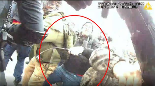 The FBI says this image shows Taake holding a metal whip as he battled officers at the Capitol on Jan. 6. (Photo: FBI)