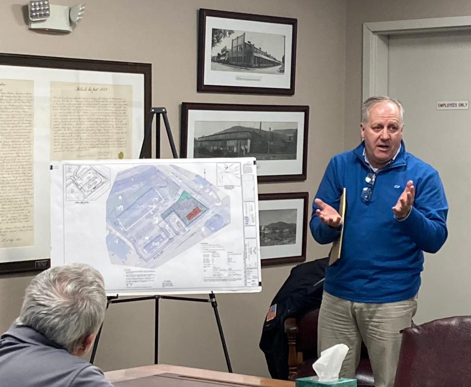 Peter Vars, of engineering firm BME Associates, presents plans for a Taco Bell to the Village of Wellsville Board of Trustees Monday evening.