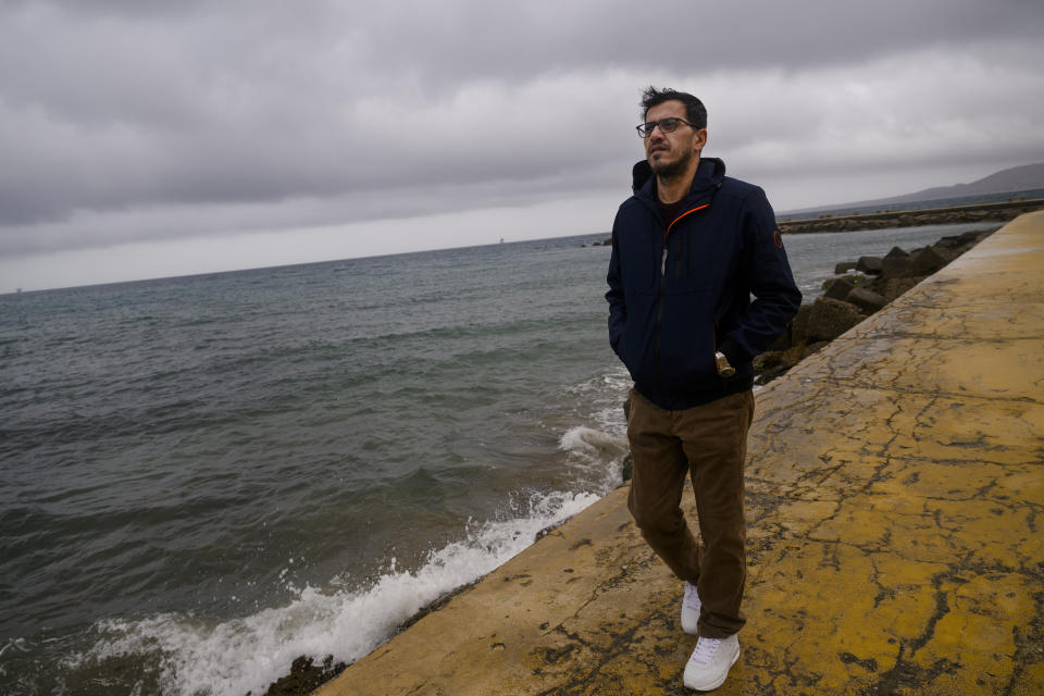 Mojtaba Rezapour Moghaddam, 47, from Mashad, Iran, walks on a pier in Crotone, southern Italy, Saturday, Feb. 24, 2024. Moghaddam survived a shipwreck when a migrant boat capsized in the early morning of Sunday, Feb. 26, 2023, at a short distance from the shore in Steccato di Cutro, near Crotone in the Italian southern tip, killing at least 94 people. Survivors and family members of the victims are converging in the area for a commemoration on Monday, Feb. 26, 2024, on the first anniversary of the disaster. (AP Photo/Valeria Ferraro)