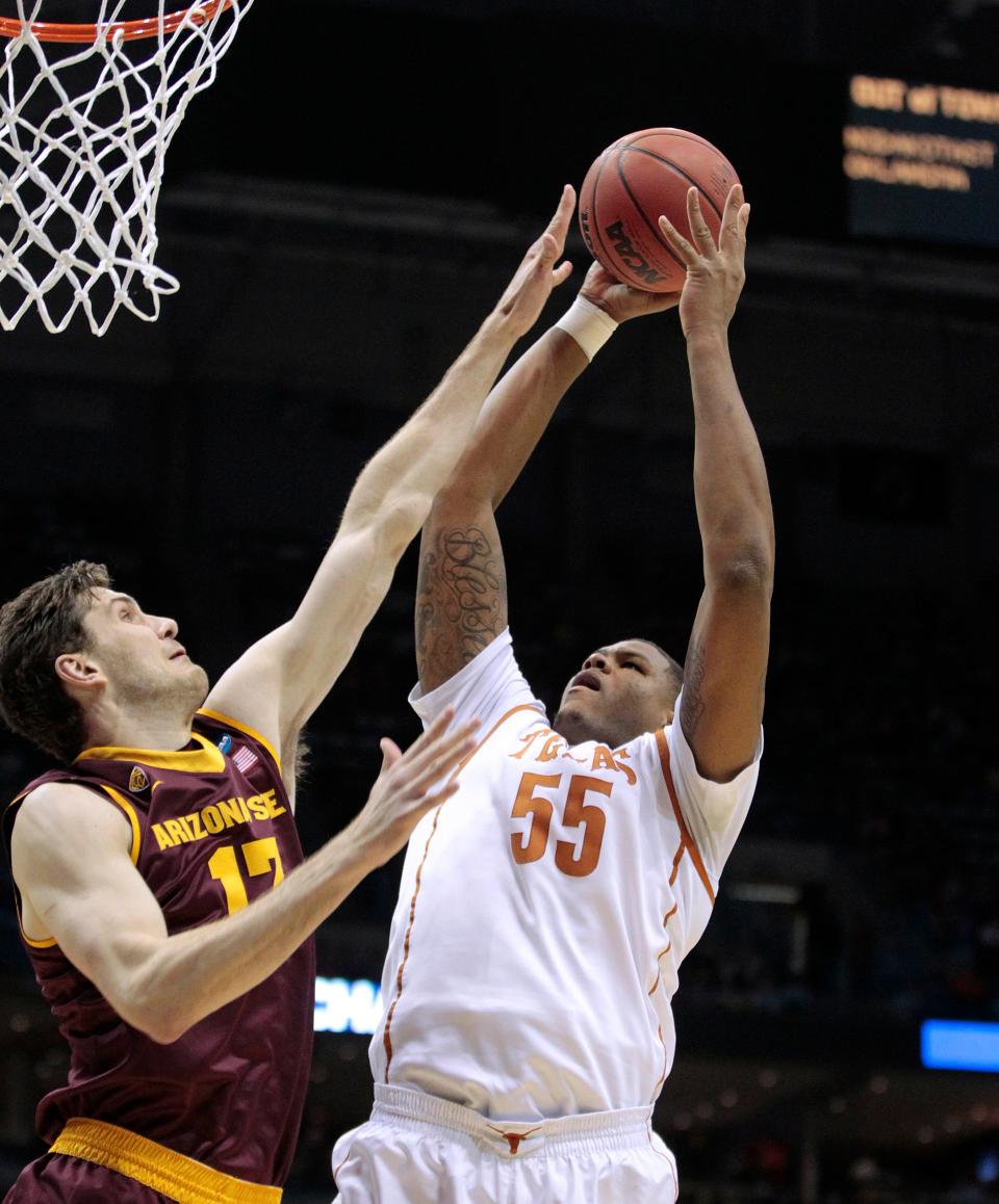 Texas Longhorns center Cameron Ridley (55) scores against Arizona State Sun Devils center Jordan Bachynski (13) during the second round of the NCAA Men's Basketball Championship between Texas and Arizona State at the BMO Harris Bradley Center in Milwaukee, Wisconsin, Thursday, March 20, 2014. Milwaukee Journal Sentinel photo by Rick Wood/rwood@journalsentinel.com