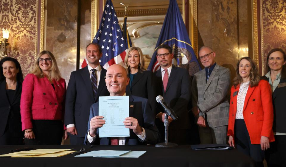 Gov. Spencer Cox poses for a photo after signing HB311, Social Media Usage Amendments, at the Capitol in Salt Lake City.