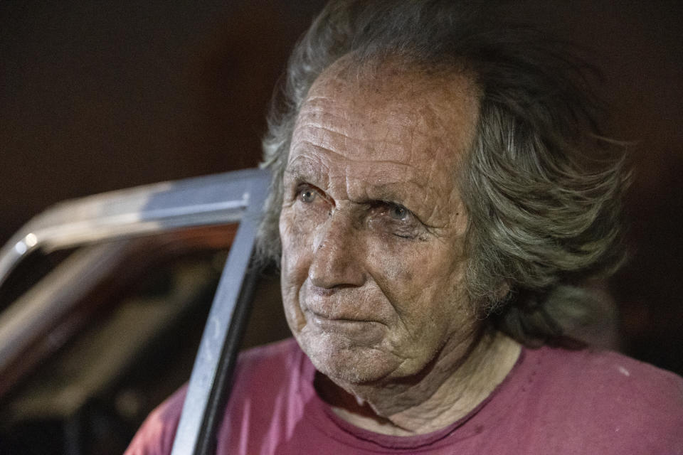 Tom Smith stares at a burning home on Platina Road after refusing to evacuate from the Zogg Fire near Ono, Calif., on Sunday, Sep. 27, 2020. (AP Photo/Ethan Swope)