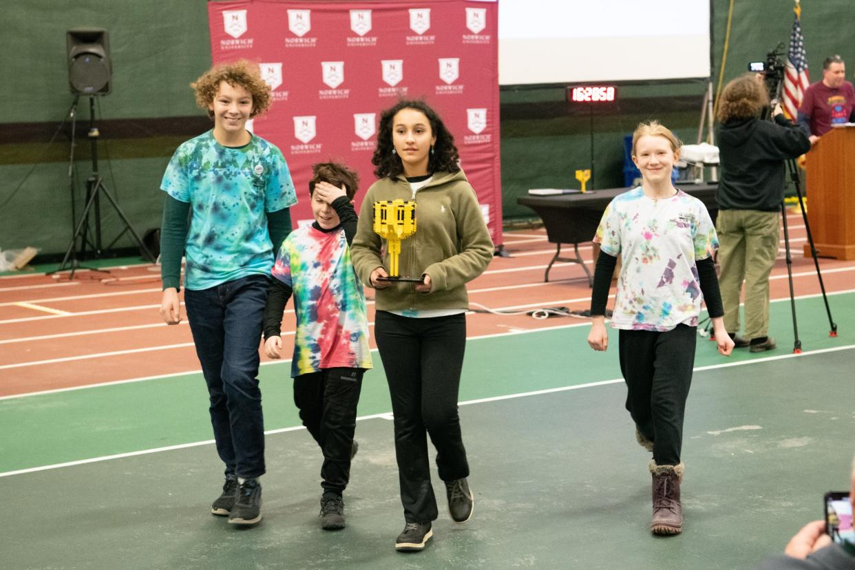 The Green Mountain Homeschool Robotics Team after they found out they had won the Vermont robotics championship for the middle school age bracket at the state competition at Norwich University in January 2024. The team had just claimed their trophy. From left are Ted Agnew, J.J. Garcia, Arielle Brkovic and Emilyn Leinen.