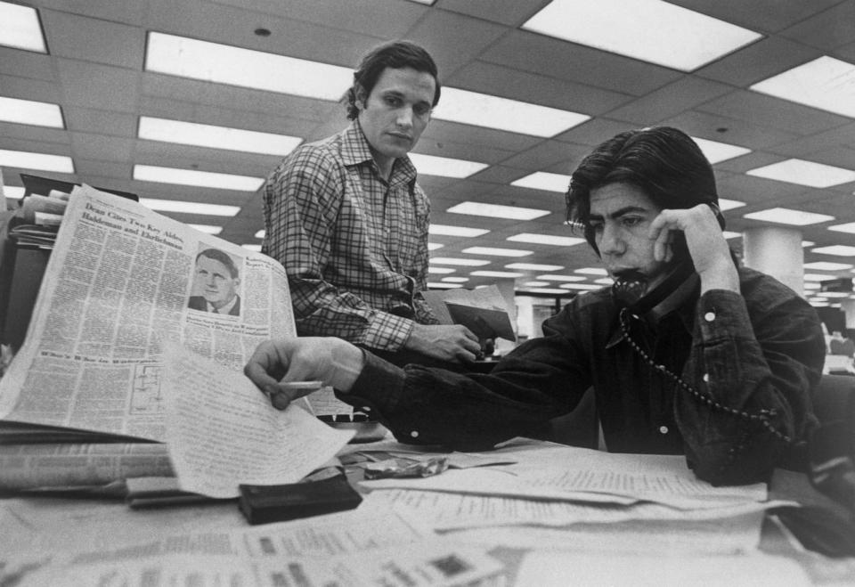 PHOTO: Bob Woodward (left) and Carl Bernstein, Washington Post staff writers who have been investigating the Watergate case, at their desk in the Post. (Bettmann Archive/Getty Images)