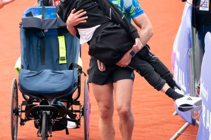 The emotional moment Kevin carried Rob across the finish line last year