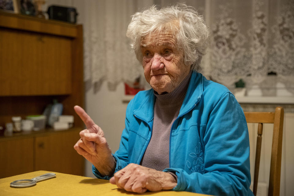 In this photo taken Friday, Jan. 24, 2020, Nazi camps survivor Marija Frlan, who will turn 100 on the Holocaust Remembrance day, talks to the Associated Press during an interview at her home in Rakek, Slovenia. Frlan, who was held at the Ravensbruck camp in northern Germany for over a year in 1944-45, will join other survivors and officials in Poland on Monday for the ceremonies marking the 75th anniversary of the liberation of the Auschwitz camp. (AP Photo/Darko Bandic)