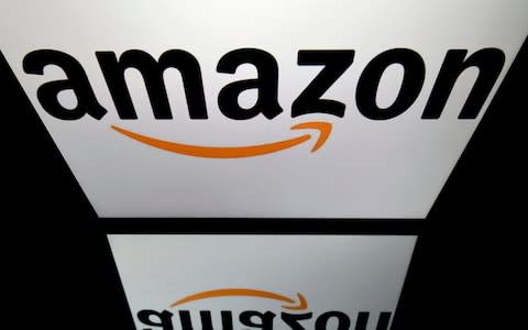 The logo of the online retail giant Amazon is displayed on a tablet  - Credit: Lionel Bonaventure/AFP Getty Images 
