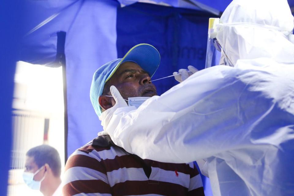 A foreign construction worker is screened for Covid-19 at a clinic in Pudu, May 15, 2020. — Picture by Choo Choy May