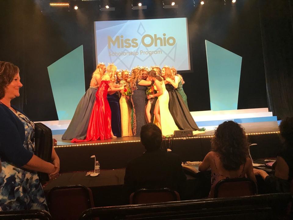 As is tradition, contestants at Miss Ohio all hug the preliminary winners Friday night at the Renaissance Theatre stage in Mansfield.