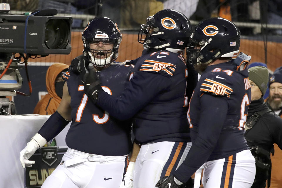 Chicago Bears offensive tackle Bradley Sowell (79) celebrates a touchdown reception with teammates during the second half of an NFL football game against the Los Angeles Rams Sunday, Dec. 9, 2018, in Chicago. (AP Photo/Nam Y. Huh)