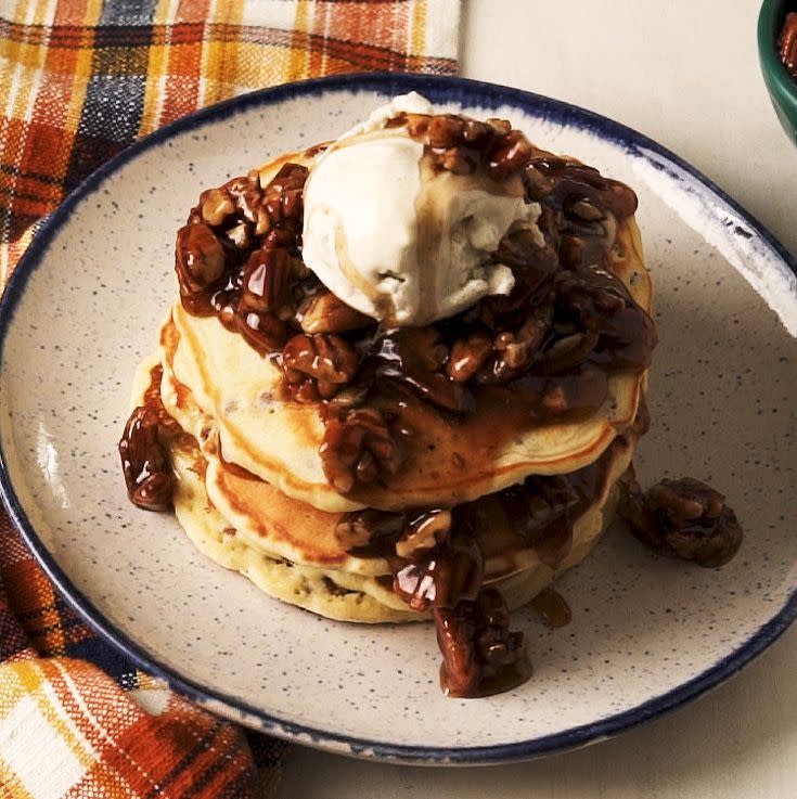 <p>Tall fluffy <a href="https://www.delish.com/uk/cooking/recipes/a30413750/perfect-pancakes-recipe/" rel="nofollow noopener" target="_blank" data-ylk="slk:pancakes;elm:context_link;itc:0;sec:content-canvas" class="link ">pancakes</a> get topped with caramelised, sticky pecan drizzle. It's the ultimate breakfast or dessert! Top it with ice cream or whipped cream for an extra indulgence. </p><p>Get the <a href="https://www.delish.com/uk/cooking/recipes/a35243320/pecan-pie-pancakes-recipe/" rel="nofollow noopener" target="_blank" data-ylk="slk:Pecan Pie Pancakes;elm:context_link;itc:0;sec:content-canvas" class="link ">Pecan Pie Pancakes</a> recipe.</p>