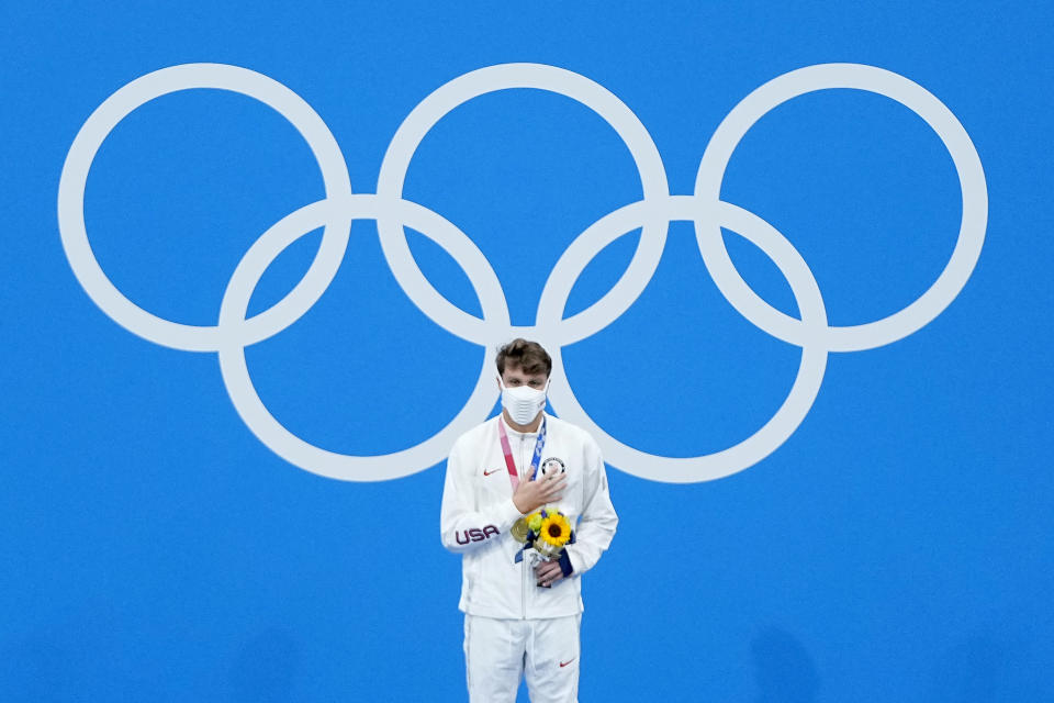 Robert Finke, of the United States, receives his gold medal in the men's 1500-meter freestyle final at the 2020 Summer Olympics, Sunday, Aug. 1, 2021, in Tokyo, Japan. (AP Photo/Jeff Roberson)