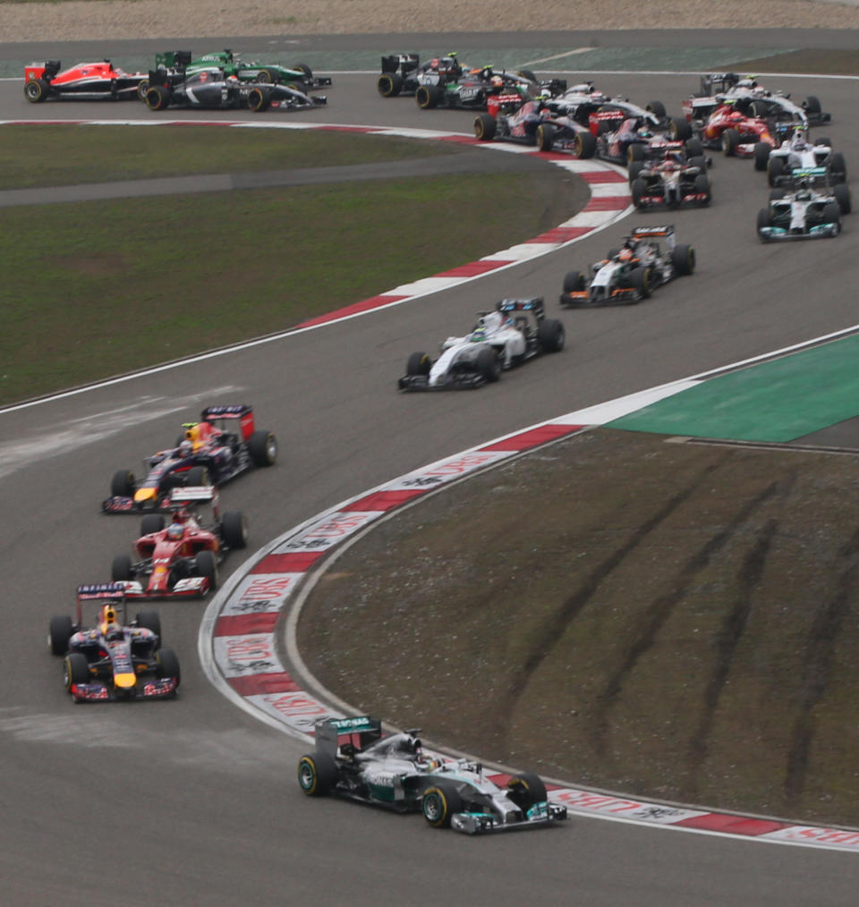 Mercedes driver Lewis Hamilton of Britain leads the field into turn three at the start of the Chinese Formula One Grand Prix at Shanghai International Circuit in Shanghai, Sunday, April 20, 2014. (AP Photo/Eugene Hoshiko)