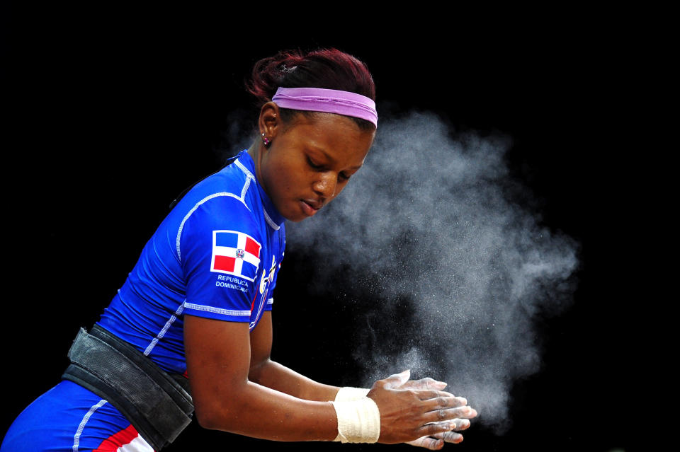 LONDON, ENGLAND - JULY 28: Beatriz Piron of the Dominican Republic prepares for a lift in the Women's 48kg Group A weightlifting on Day 1 of the London 2012 Olympic Games at ExCeL on July 28, 2012 in London, England. (Photo by Laurence Griffiths/Getty Images)