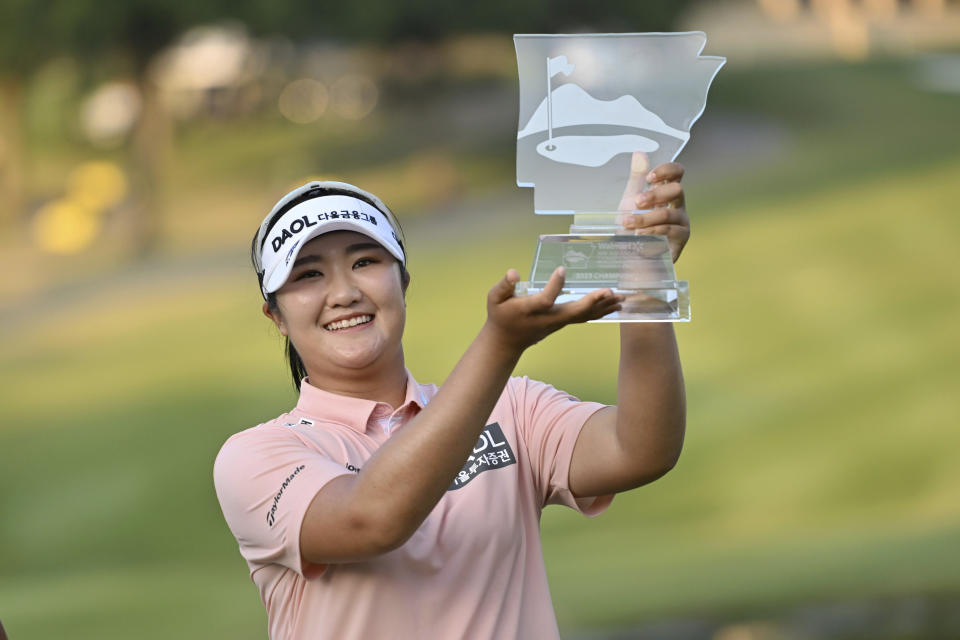 Hae Ran Ryu holds up the trophy after wining the LPGA Walmart NW Arkansas Championship golf tournament, Sunday, Oct. 1, 2023, in Rogers, Ark. (AP Photo/Michael Woods)