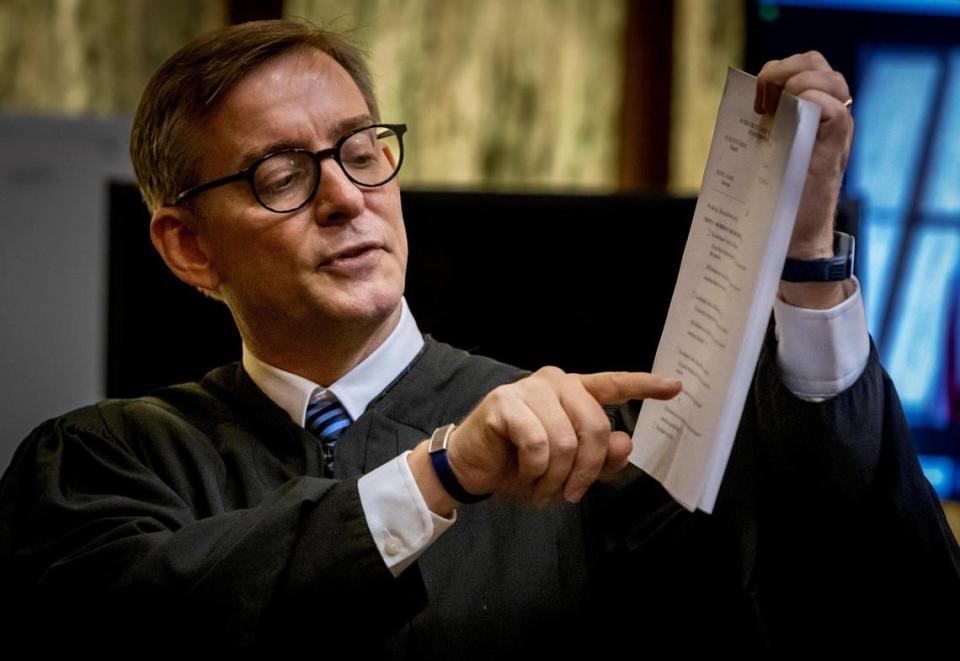 Judge Miguel de la O goes over the verdict form in front of the jury in the trial of Manuel Marin, a former Presidente Supermarket executive accused of masterminding the murder of his wife’s lover in 2011.