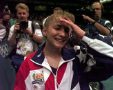 FILE - In this July 23, 1996, file photo, members of the media pursue USA's Shannon Miller, of Edmond, Ohio, after the U.S. women's national gymnastics team won the gold in the team competition at the Centennial Summer Olympic Games in Atlanta. (AP Photo/Amy Sancetta, File)