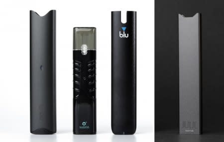 An electronic cigarette device made by JUUL (R) is shown next to other similar devices (L to R) Vuse Alto, Suorin ishare and myblu in this photo illustration taken September 20, 2018.   Picture taken September 20, 2018.    REUTERS/Mike Blake/Illustration
