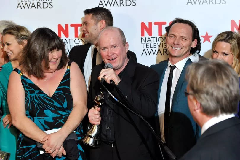 Cheryl Fergison next to Steve McFadden (C) and the cast of EastEnders as they win Most Popular Serial Drama award during the National Television Awards at the O2 Arena on January 26, 2011