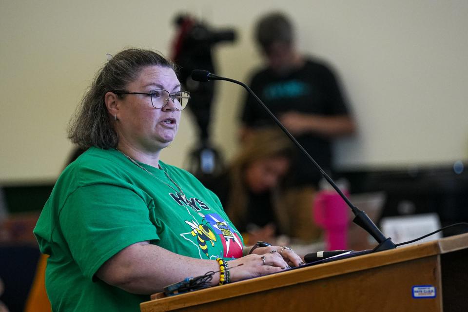 Kaitlyn Holden, a Hays CISD bus driver and parent speaks at a Hays Consolidated Independent School District Board of Trustees special meeting on the district's school bus seat belt plan at the Historic Buda Elementary Campus on Monday.