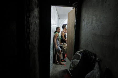 Detainees are pictured inside a hidden room at a police station in Manila, Philippines April 27, 2017. REUTERS/Vincent Go