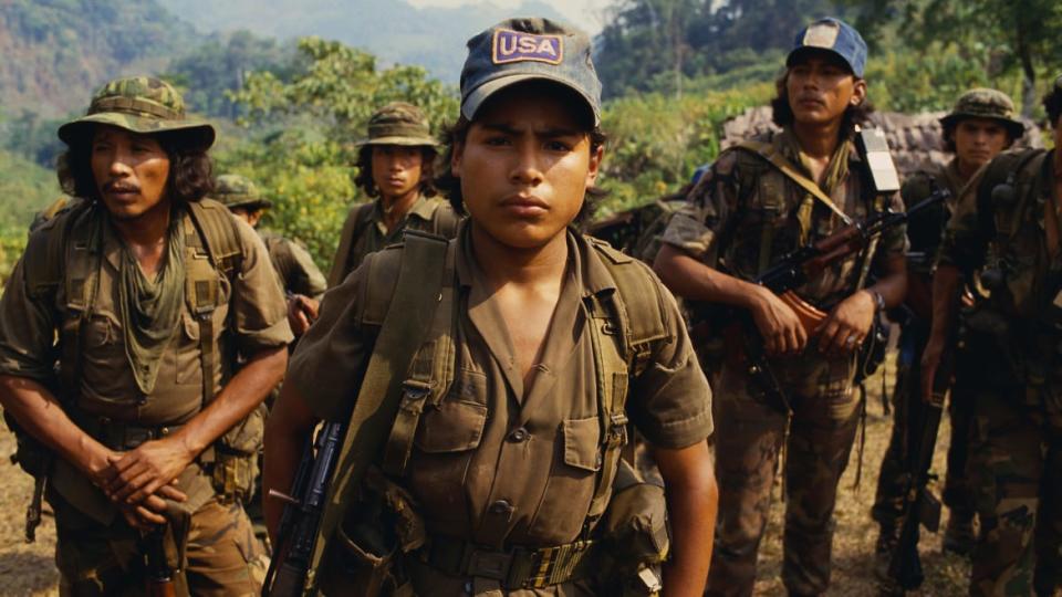 <div class="inline-image__caption"><p>Contra rebels patrolling the northern mountains of Nicaragua. One soldier wears a ‘USA’ baseball hat, representing the country that aids their anti-Sandinista struggle.</p></div> <div class="inline-image__credit">William Gentile/Corbis via Getty</div>