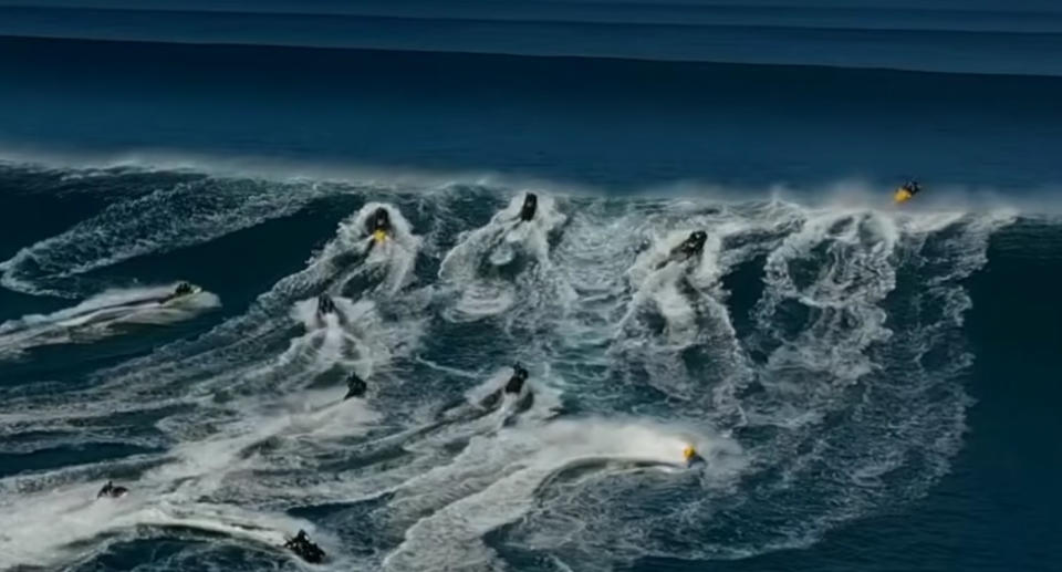 A huge group of jet skis scrambled to pass over the wave in time to land safely. Source: Surfline