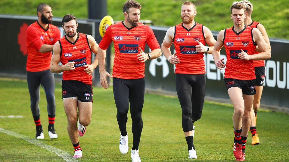 Conor McKenna, pictured here with some Essendon teammates at training.