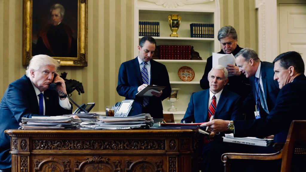 Trump on the phone with Putin, surrounded by advisers.