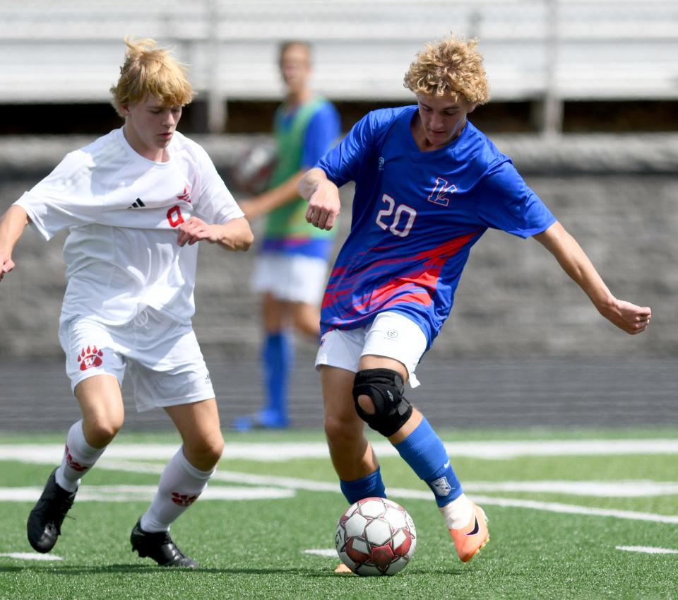 Wadsworth's Lucas Van Eck pressures Lake Shane Grisan on a pass in Wadsworth at Lake boys soccer.  Saturday, Sept. 02, 2023.