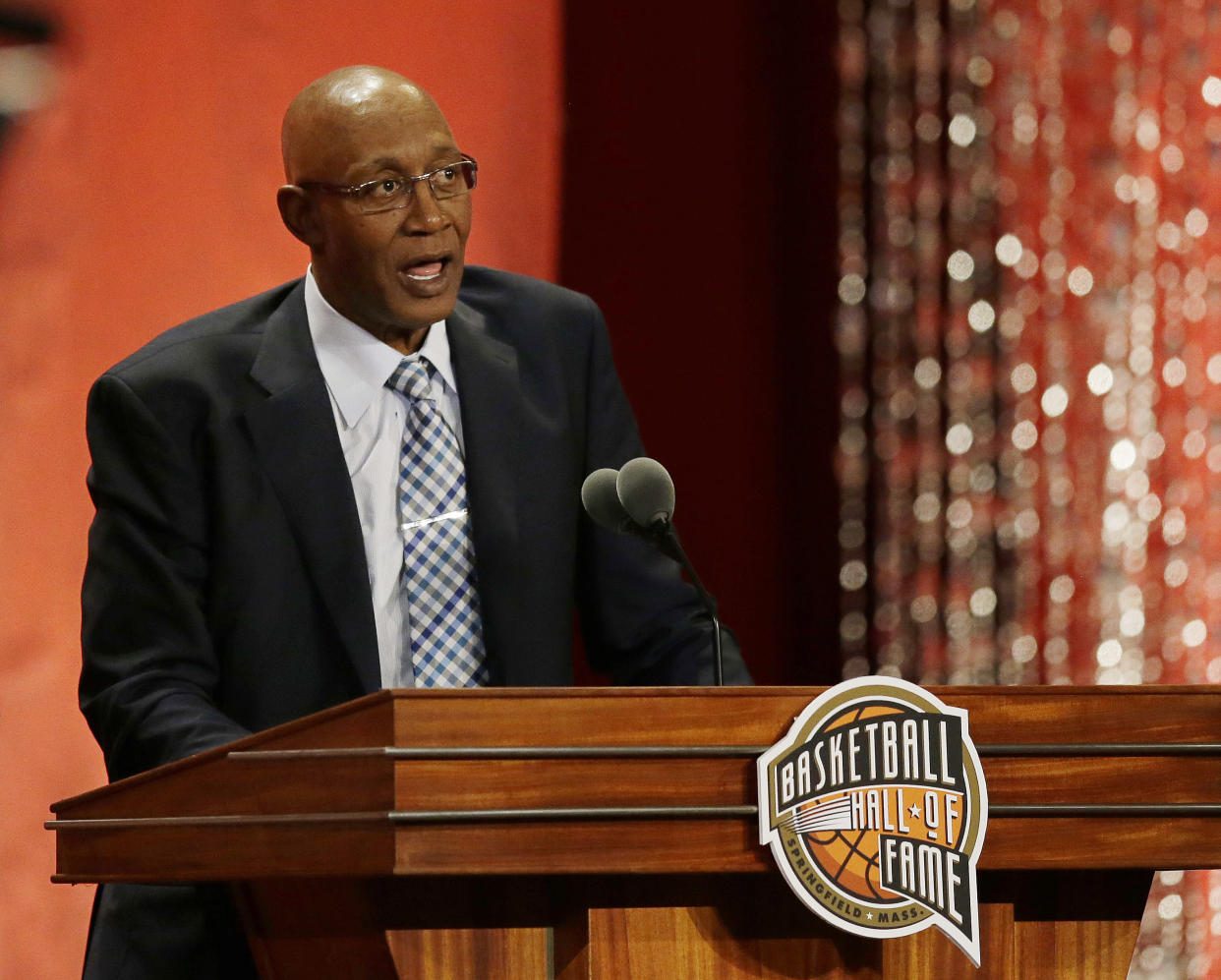 Former NBA star George McGinnis speaks during his enshrinement into the Naismith Memorial Basketball Hall of Fame on Friday, Sept. 8, 2017, in Springfield, Mass. (AP Photo/Stephan Savoia)