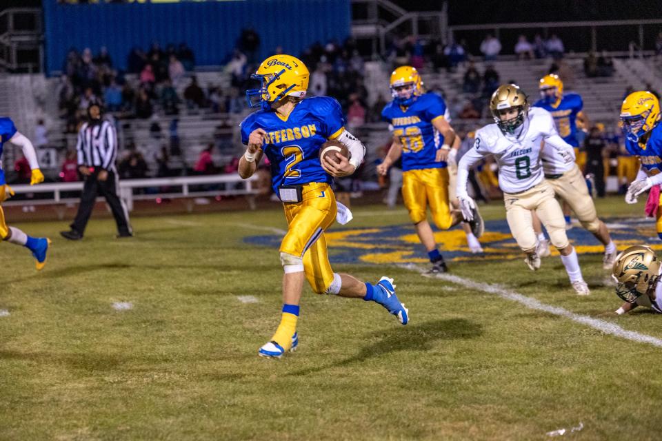 Luke Beaudrie runs the ball for Jefferson against St. Mary Catholic Central Friday night. SMCC won 41-14.