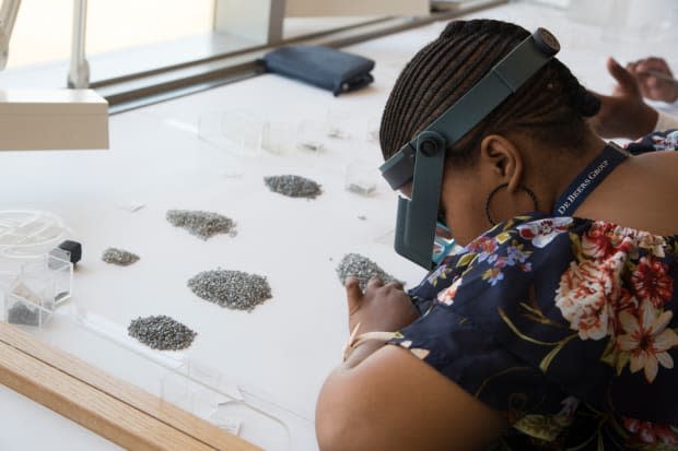 A diamond sorter at work in Gaborone, Botswana. Photo: Sophie Elgort/Courtesy of Forevermark