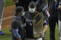 Los Angeles Dodgers third baseman Justin Turner celebrates with the trophy after defeating the Tampa Bay Rays 3-1 to win the baseball World Series in Game 6 Tuesday, Oct. 27, 2020, in Arlington, Texas. (AP Photo/Sue Ogrocki)