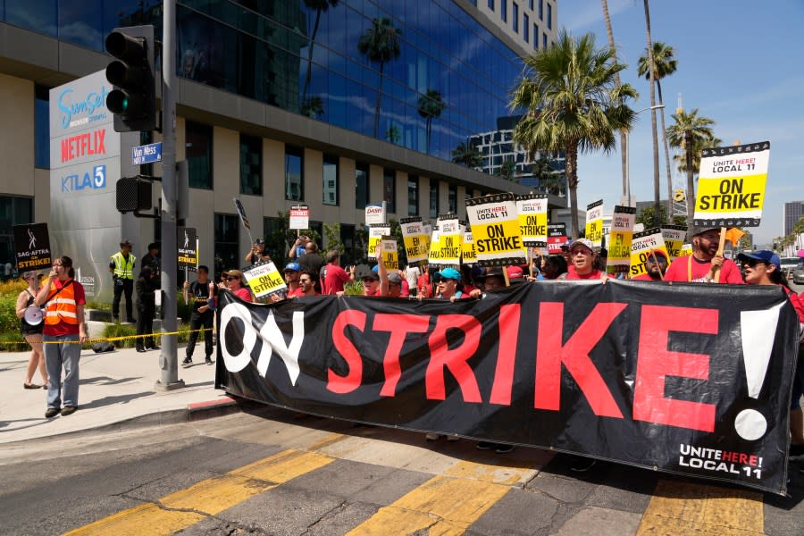 Striking Hotel workers from Unite Here Local 11 join the picketing actors of SAG-AFTRA, and writers of the WGA, outside Netflix studios on July 21, 2023, in Los Angeles. Some Democrats in the California Legislature are trying to change the law to make striking workers eligible for unemployment benefits. Business groups oppose the bill, noting California doesn't have enough money in its unemployment trust fund to pay for benefits now. (AP Photo/Chris Pizzello, File)