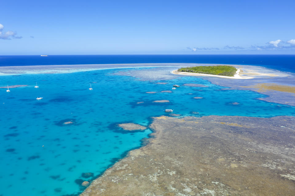 Aerial Drone views over the blue waters and coral of the great Barrier Reef, Lady Musgrave island, Queensland, Australia