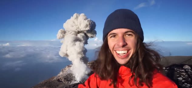 This guy just stood above an erupting volcano like it’s NBD and the footage is terrifyingly beautiful